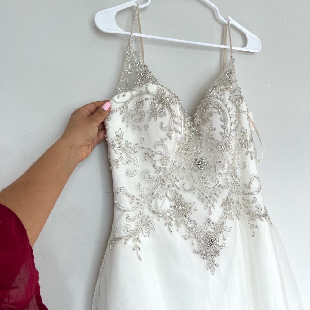Elegant White Beaded Wedding Dress - Picture 1 of 7